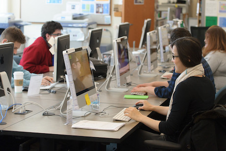 students sitting at computers in a computer lab