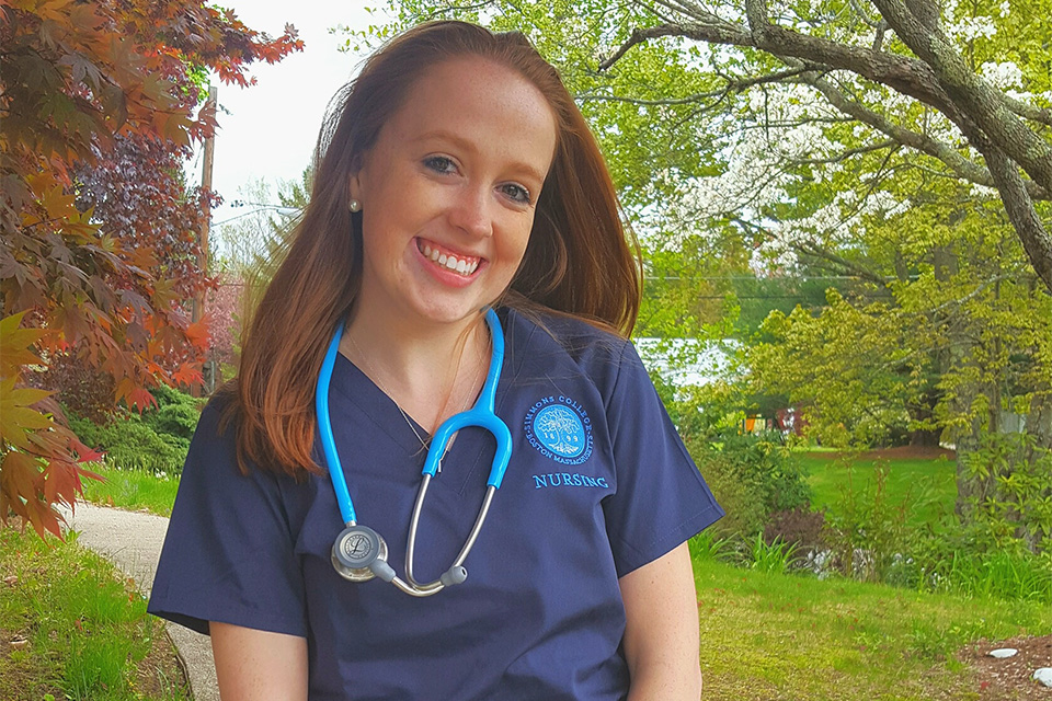 Headshot of Sam Magraw in her nursing scrubs