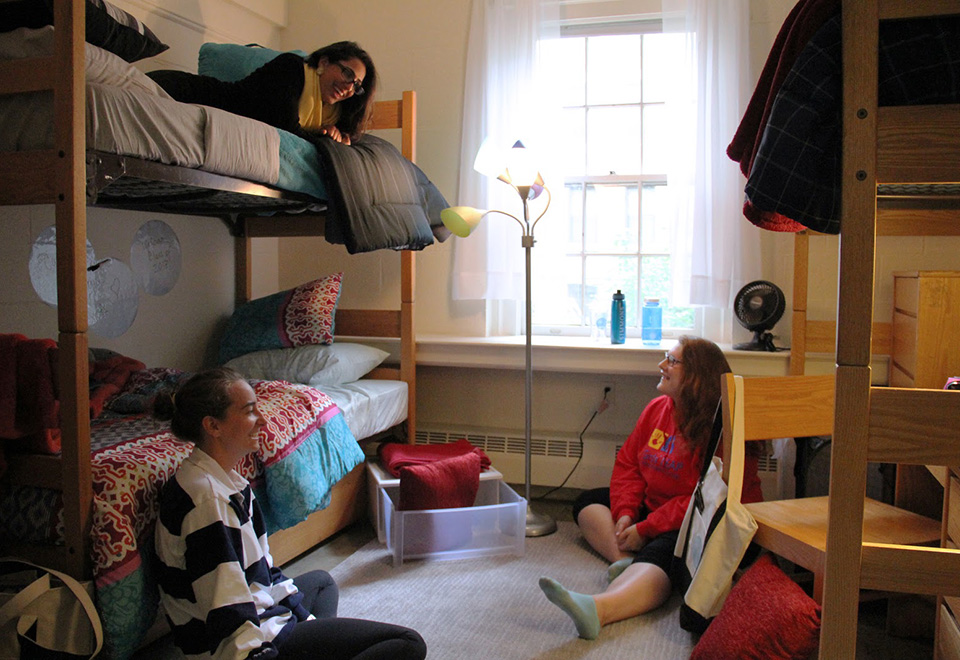 Students sitting in a dorm room