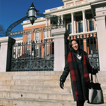 Sangha Kang-Le in front of the Massachusetts State House