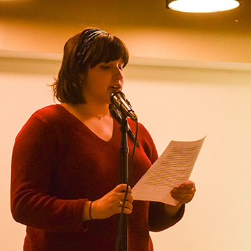 Sara Getman on stage at Sidelines Open Mic Night