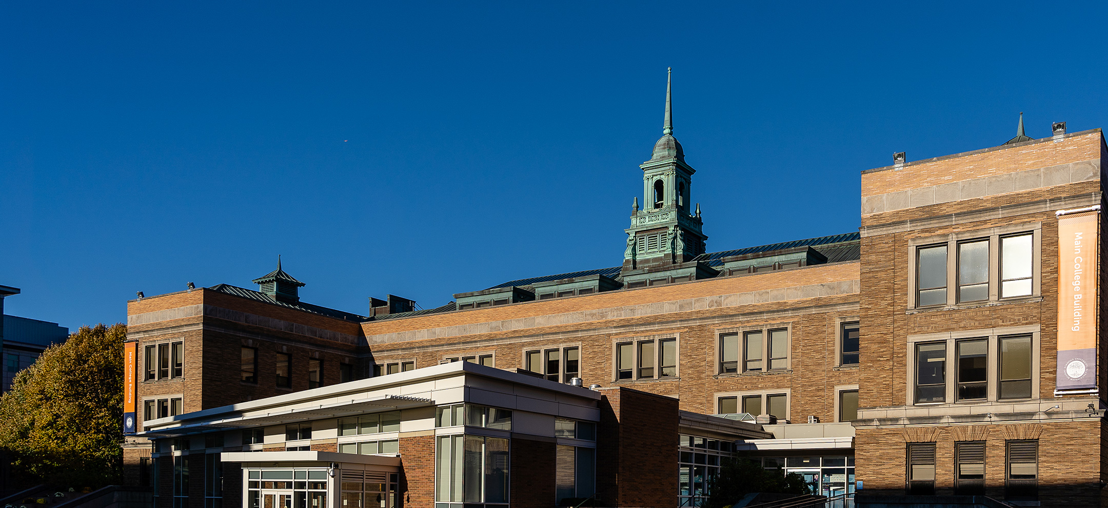 The Simmons main college building against a bright blue sky