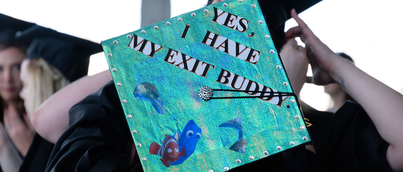 Graduation cap that reads "Yes, I have my exit buddy"