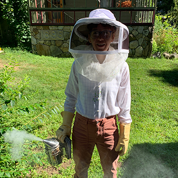 Helen Popinchalk preparing to work with bees.