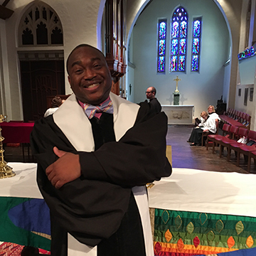 Marcus Hill standing in a church.