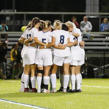 Soccer Team in Huddle