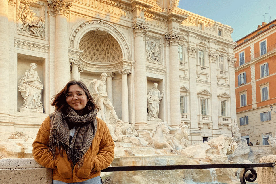 Lauren Wagner in standing in front of Roman Architecture 