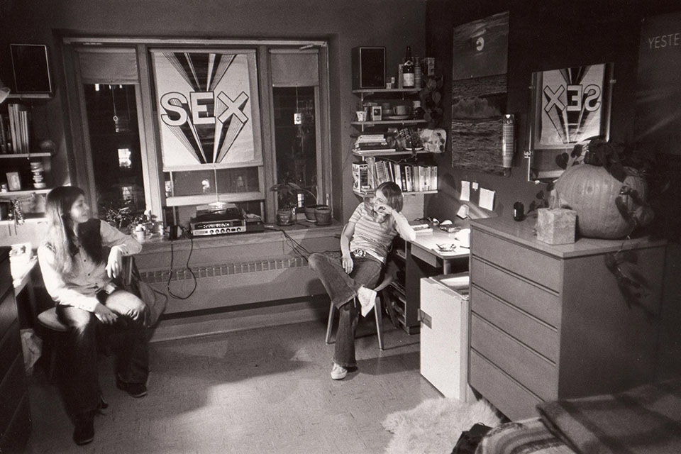 Two students in a dorm room in the 1970s.