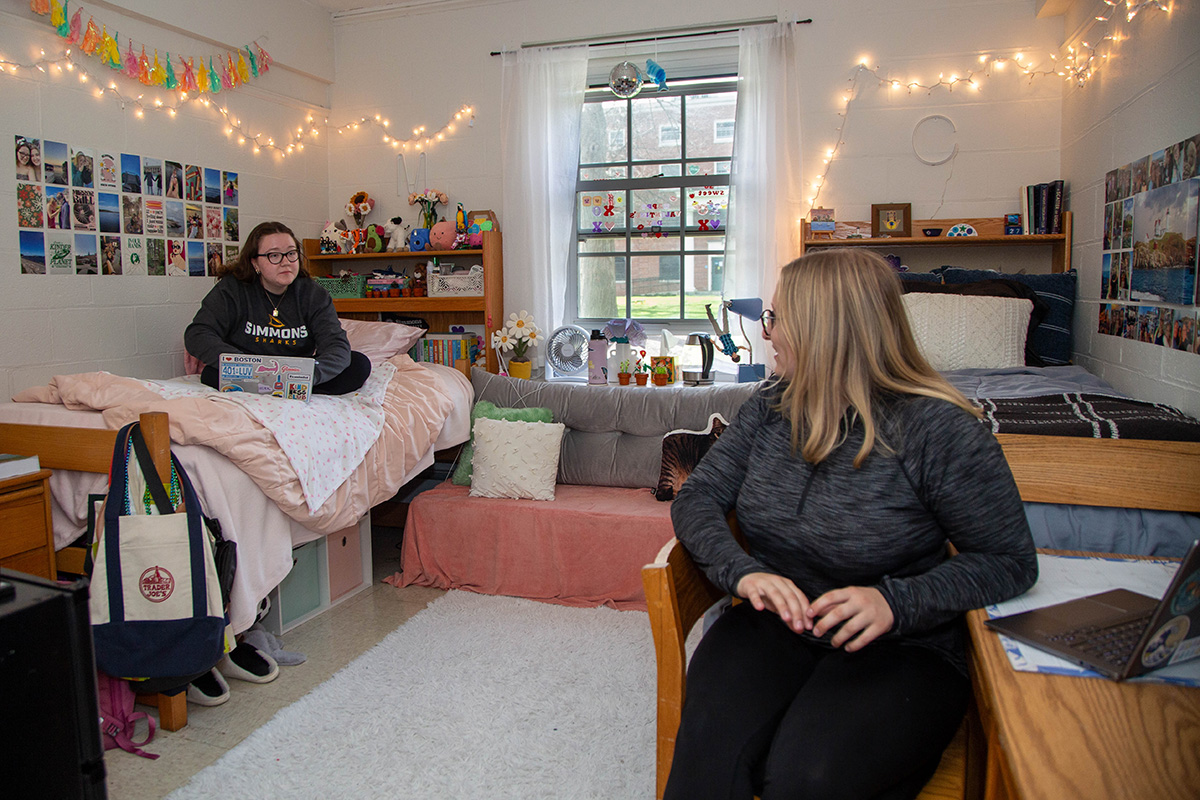 Two Simmons students talking in their residence hall room