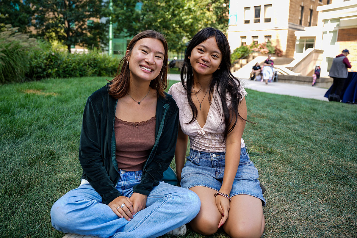 Two Simmons students enjoying a fall day on the Simmons University campus