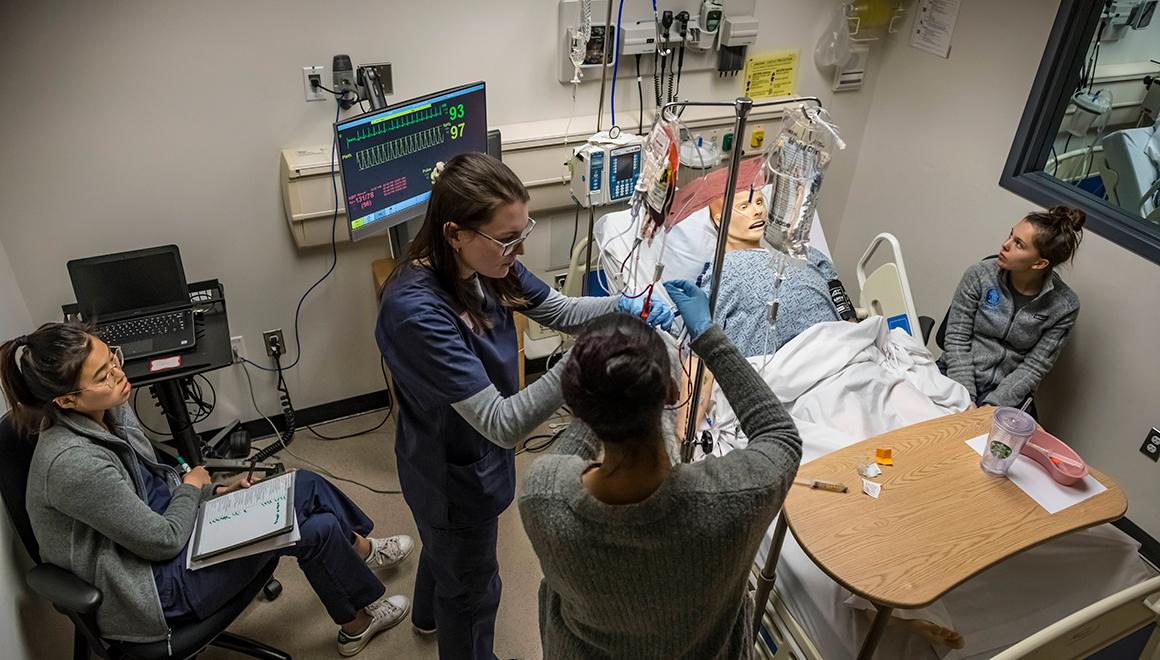 Students working in the nursing simulation lab