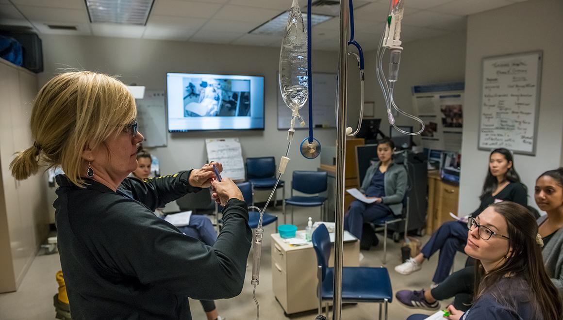 Students in a nursing simulation lab