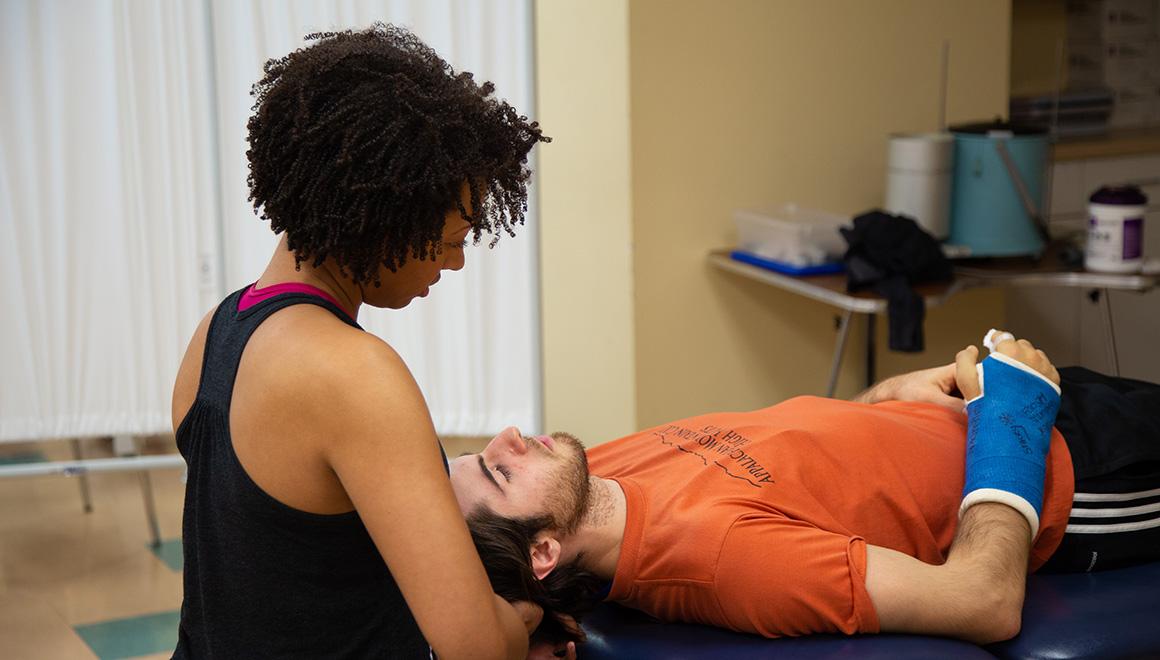 Physical therapist working with a patient