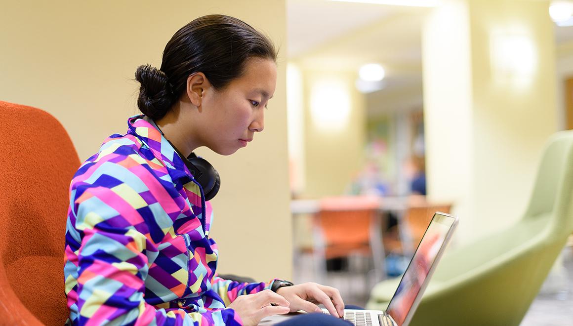 Student working on their laptop in the Student Activities Center