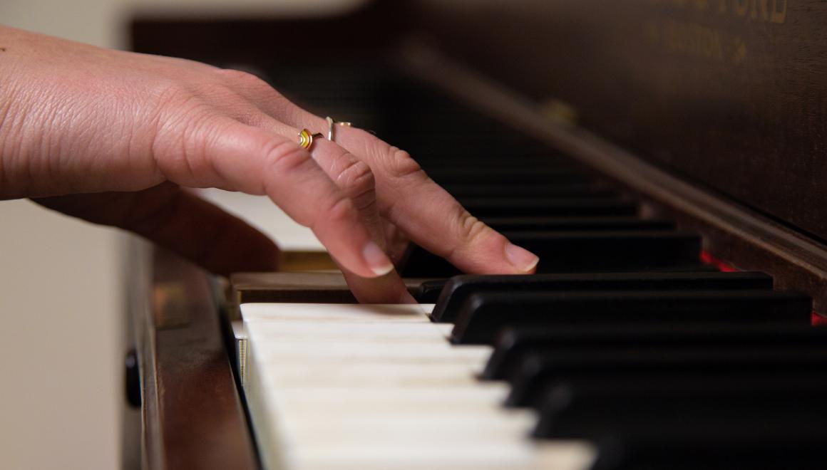 Hands on piano keys