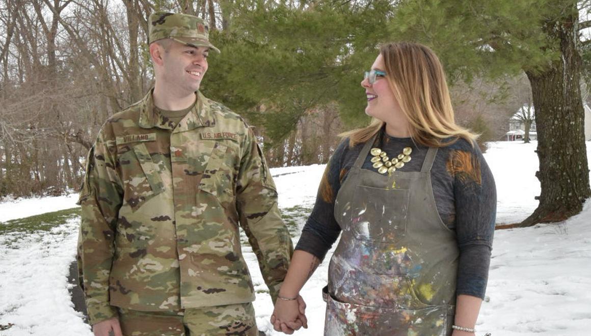 Photo of Anne Villano '21MSW and husband holding hands