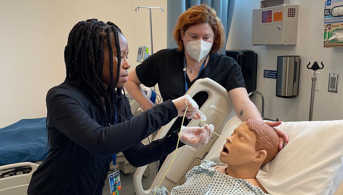Students working on test patient mannequin