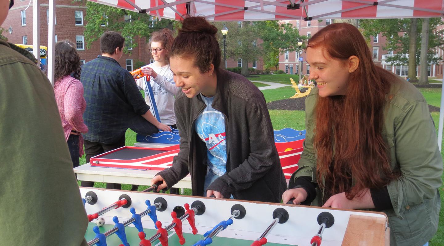 Students playing a game on the residential quad