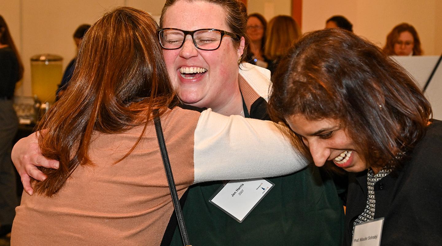 ECONnect 2025: Alums Hugging