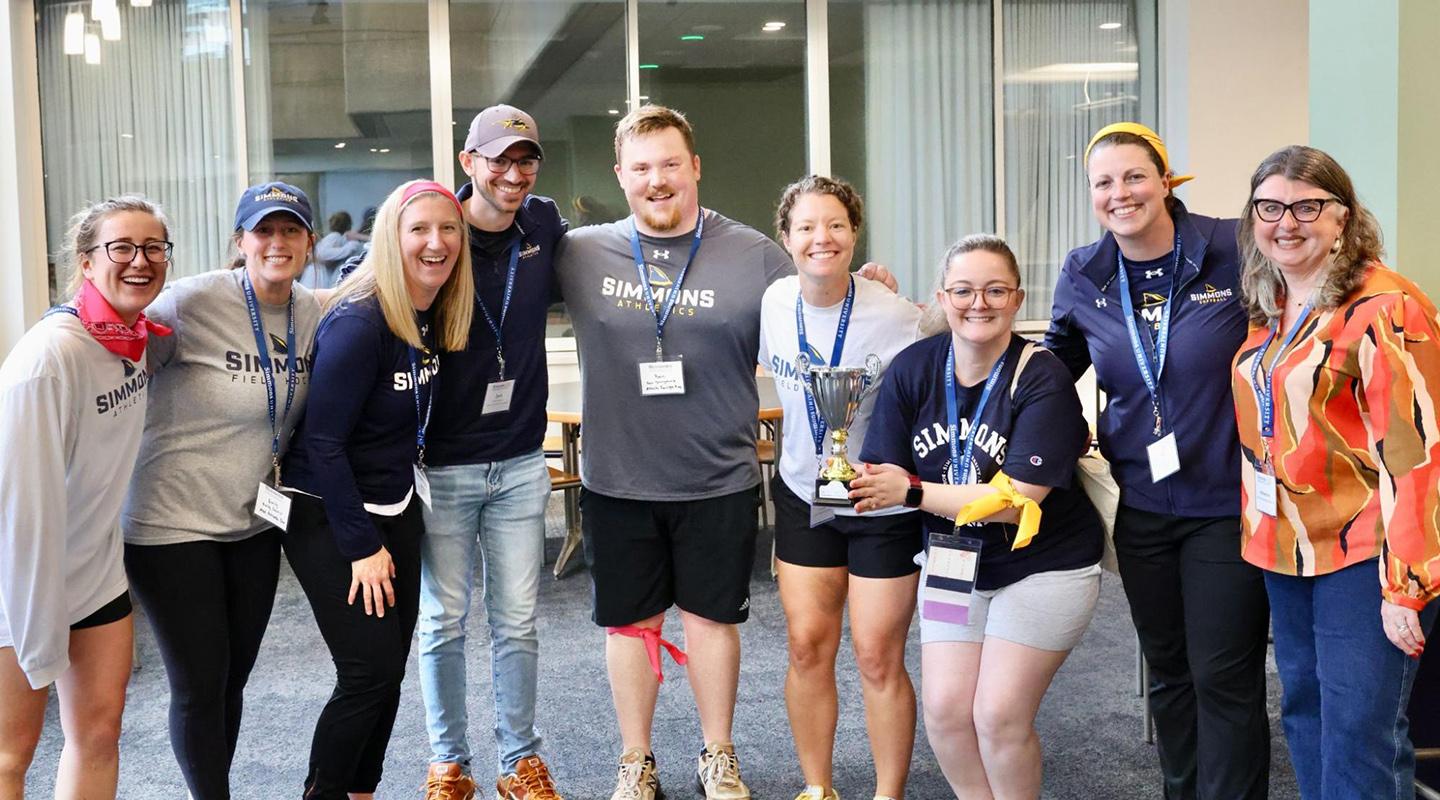 Alumns posing for photo at event