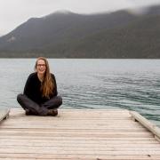Megan Ludgate sitting on a dock.