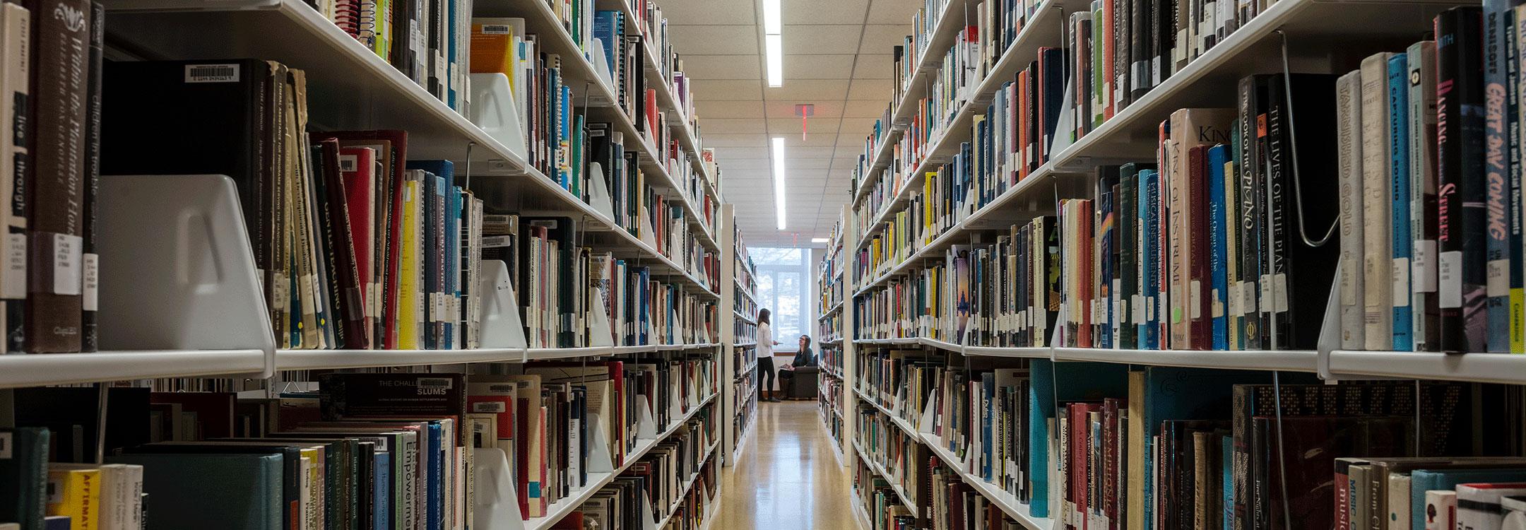 view between shelves of books