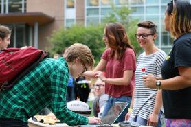 Students at an event on the residential quad