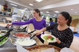 Students eating in dining hall.
