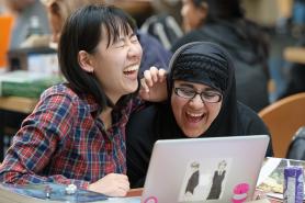 Students sitting together and laughing