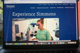 The Simmons homepage on a laptop screen