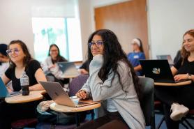 A group of Simmons behavior analysis students in a classroom