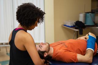 Physical therapist working with a patient
