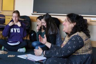 Education students sit in a circle during class. 