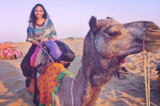 Samantha Sochan riding a camel.