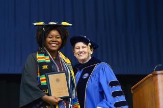 Tema Fodje receiving an award at Commencement