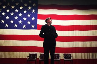 Vin Sowders standing in front of a U.S. Flag