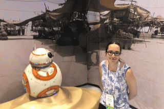 Nicole Rasmussen standing with a model of Star Wars' BB-8 at the Grace Hopper Celebration, Fall 2019.