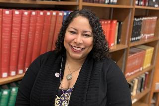 Headshot of Bridgett Pride in a library