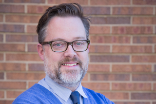 Headshot of Colin Rhinesmith