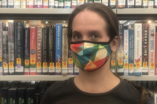 Kate Leppanen wearing a mask in the library