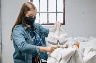 Kylie Collins sorting bags of lunch at the Columbus Dream Center