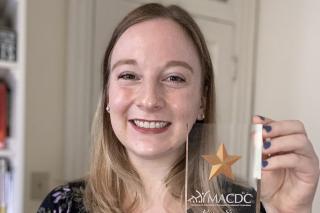 Headshot of Sarah Jenness holding her Rising Star award.