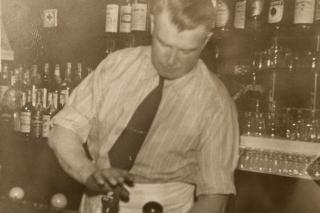 Assistant Professor Eric Poulin's great-grandfather Lester "Buster" Brown, bartending at Luchessi's Cafe in the 1940s.