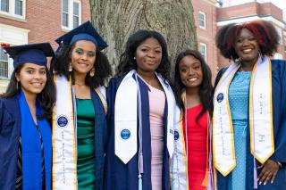 Students in caps and gowns at Simmons University