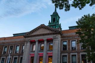 Simmons Main College building lit red for Juneteeth