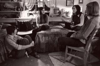 Students in the 1970s sitting together having a discussion