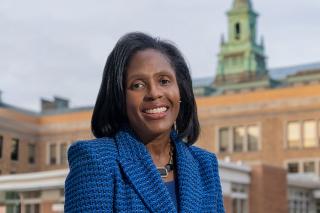 President Lynn Wooten standing in front of the MCB