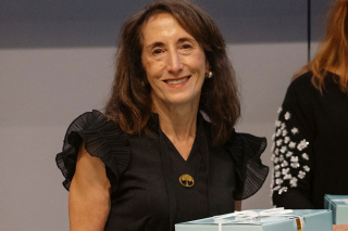 Linda Siperstein Adler ’73 seated at a table during her 50th class reunion