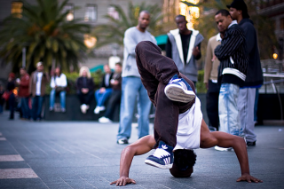 B Boy executing a freeze, circa 2014, Wikimedia (public domain)