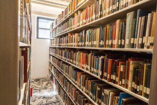 A row of books in the Simmons University library